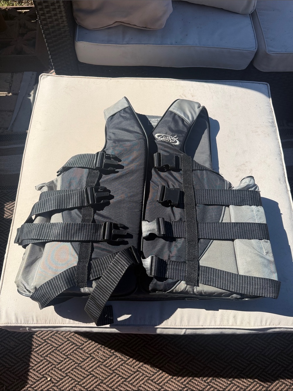 Men's Black and Gray Life Jacket with Adjustable Buckles